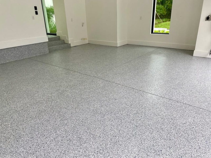 Light gray full-flake epoxy floor in a bright interior room