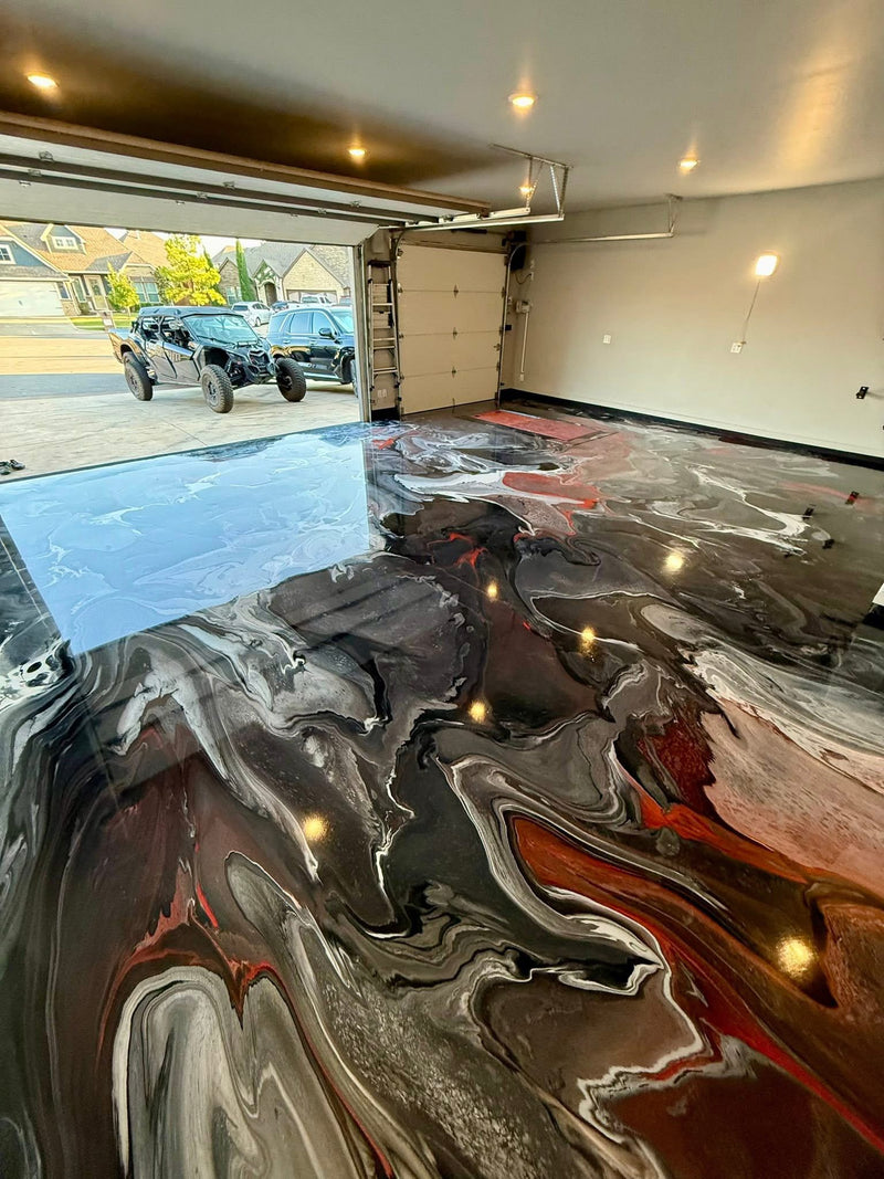 Black, copper and red metallic epoxy garage floor with the door open