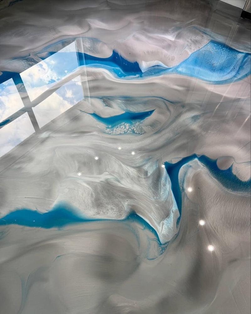 White, blue and silver ocean-wave metallic epoxy floor