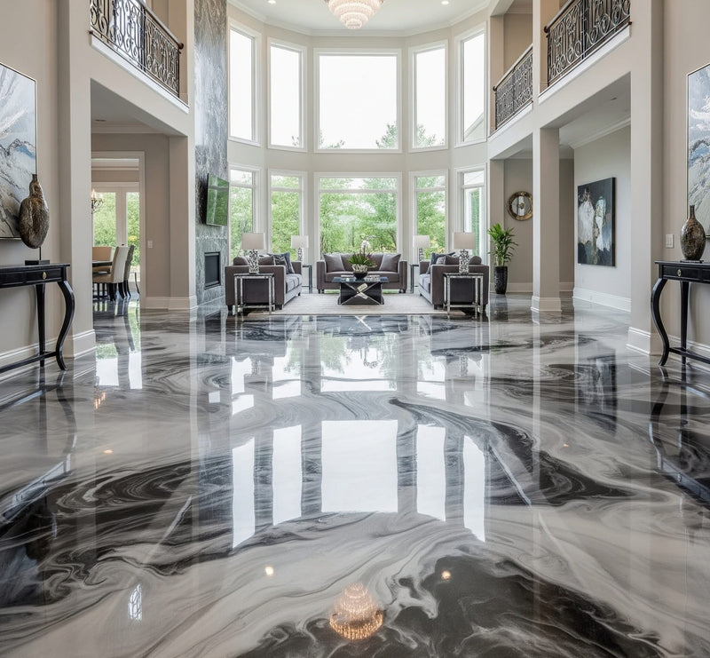 Black and white marbled metallic epoxy floor in a two-story great room with tall windows