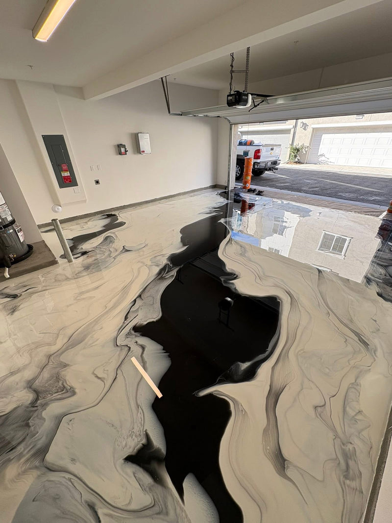 Black, white and gray river-style metallic epoxy garage floor