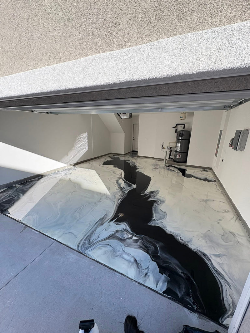 Black, white and gray river-style metallic epoxy garage floor